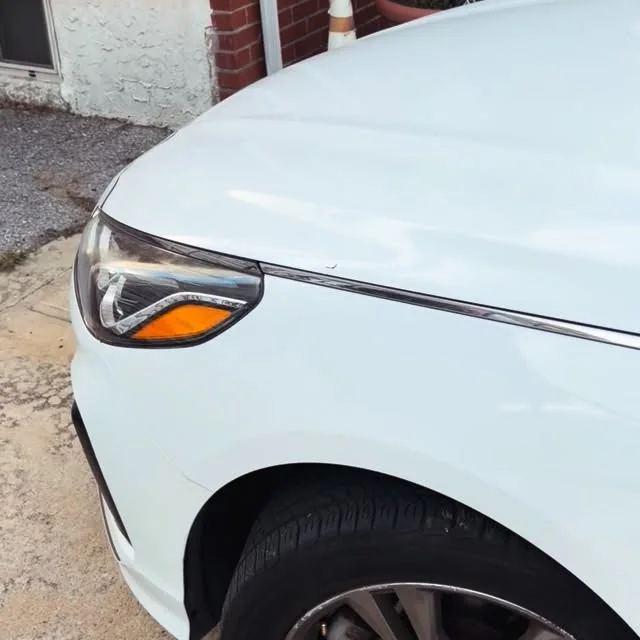 Clean white vehicle after maintenance car detailing in Queens, New York